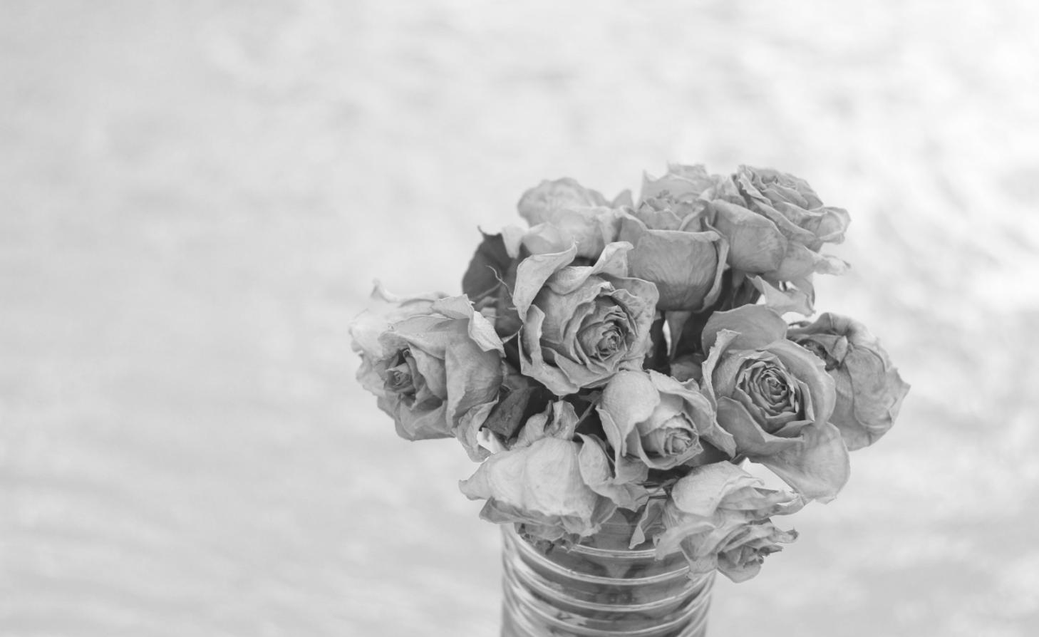 Floral arrangement workspace with fresh flowers and tools
